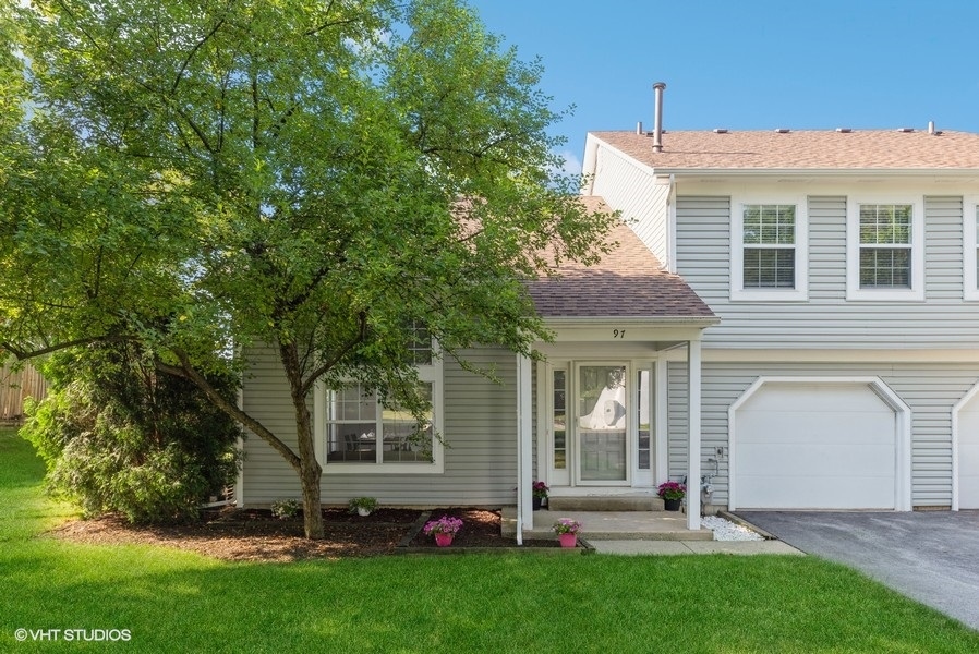 front view of a house with a yard