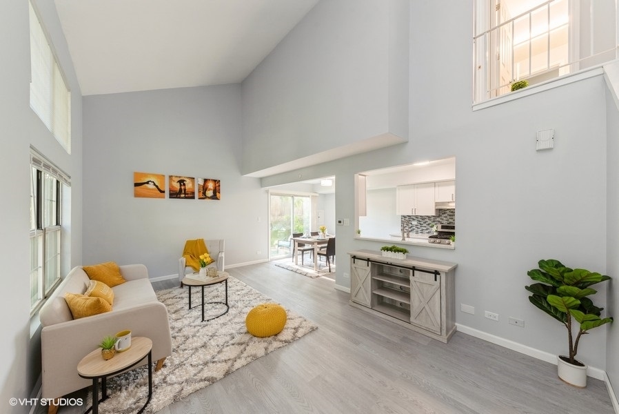 97 Hazelnut Drive Streamwood, IL 60107 - Photo 2 of 14 a living room with furniture and wooden floor