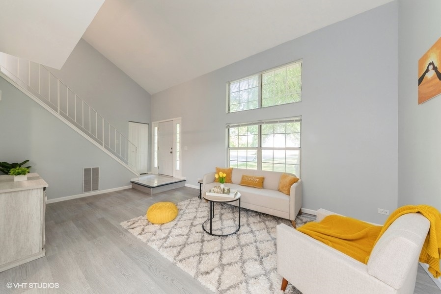 97 Hazelnut Drive Streamwood, IL 60107 - Photo 3 of 14 a living room with furniture and wooden floor