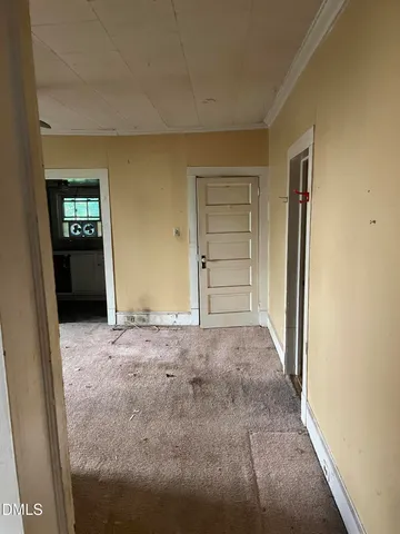 a view of empty room with windows