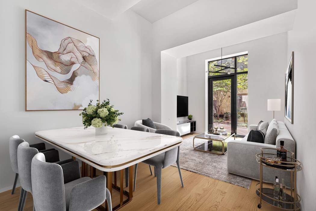 98 Front Street, Unit GRD Brooklyn, NY 11201 - Photo 1 of 23 a view of a livingroom with furniture and window