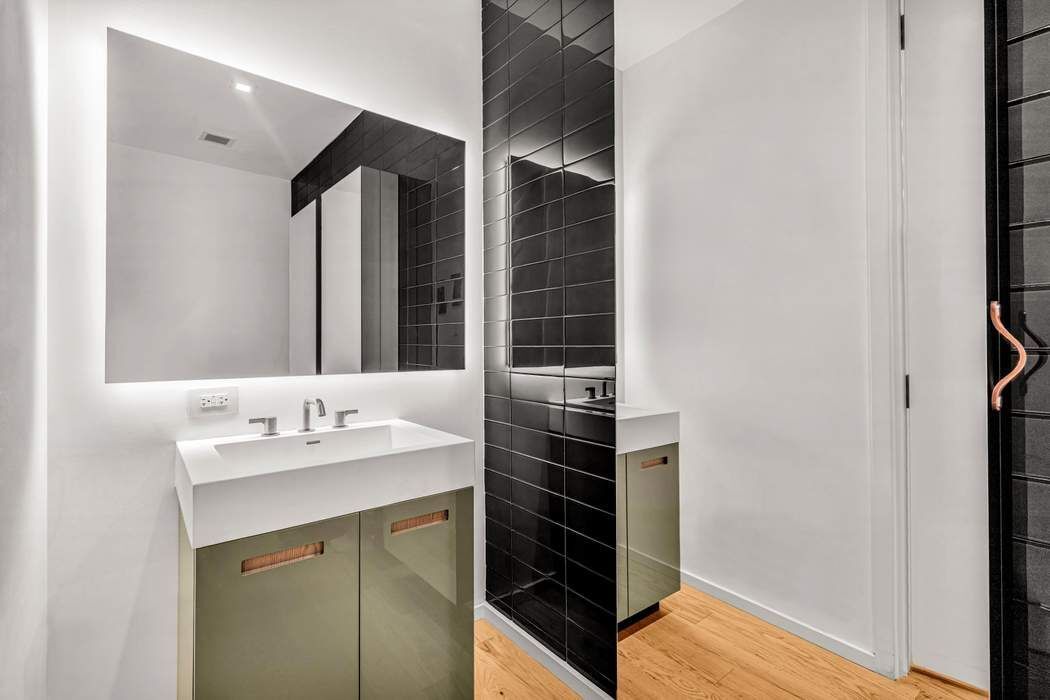 98 Front Street, Unit GRD Brooklyn, NY 11201 - Photo 14 of 23 a bathroom with a sink and a mirror