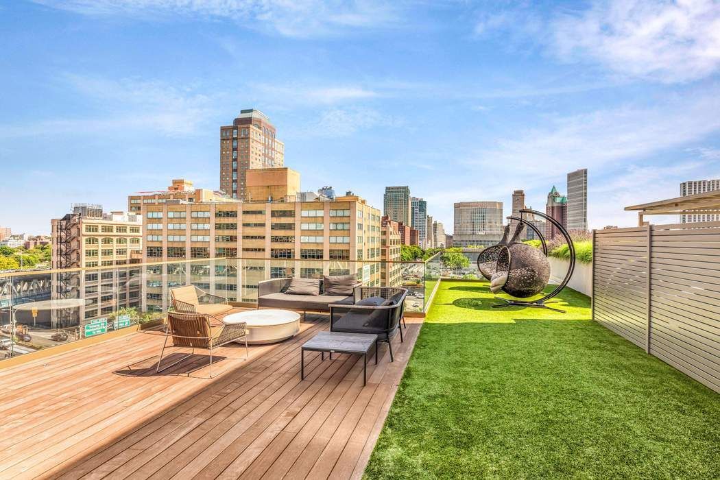 98 Front Street, Unit GRD Brooklyn, NY 11201 - Photo 16 of 23 a view of a city with tall buildings and a bench