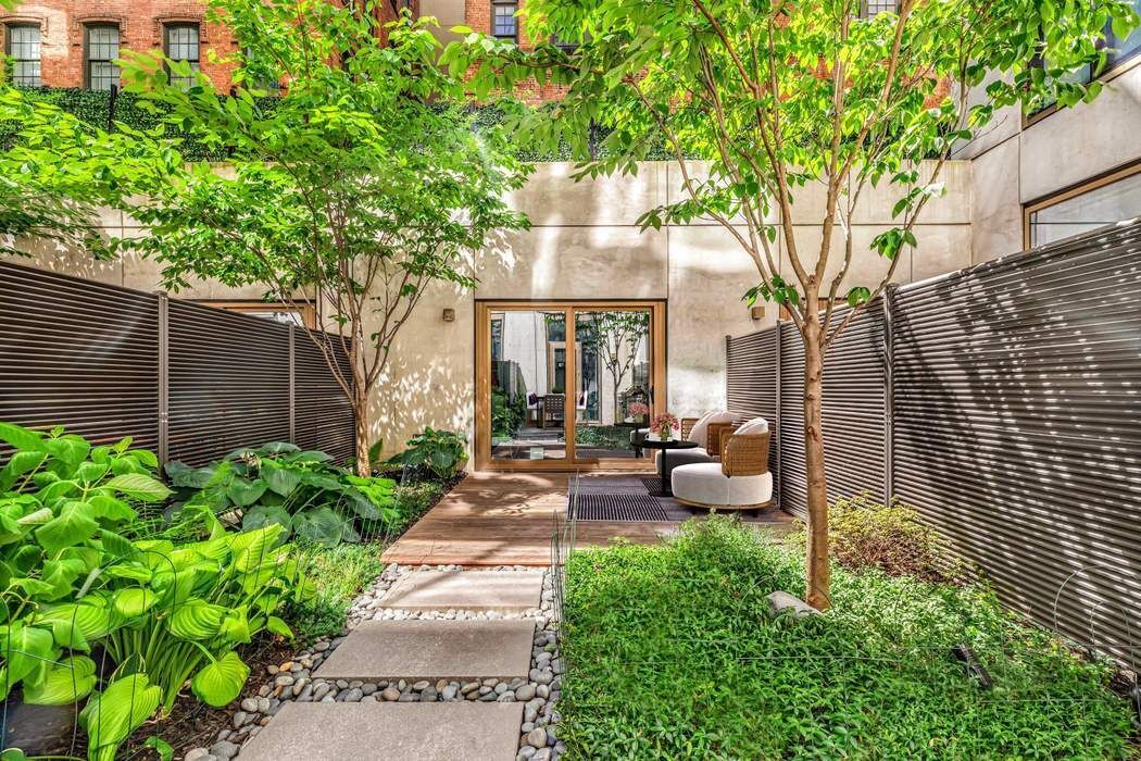98 Front Street, Unit GRD Brooklyn, NY 11201 - Photo 2 of 23 a view of a patio with couches table and chairs and potted plants