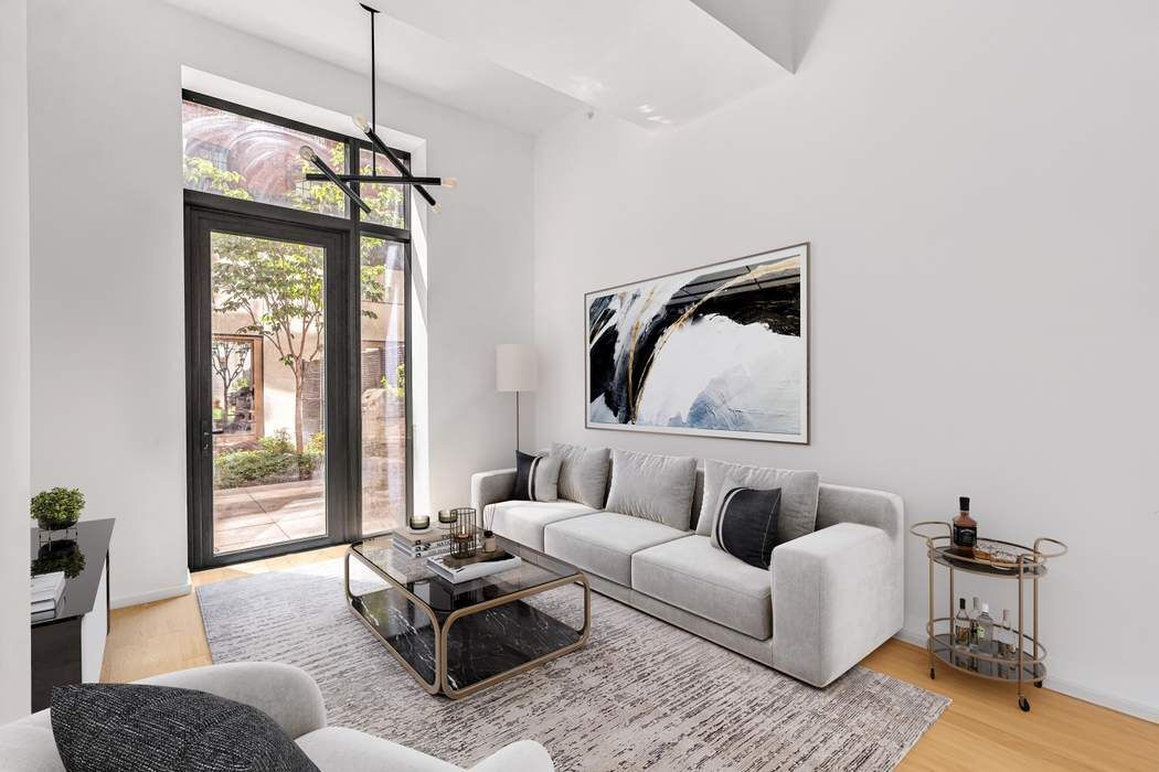 98 Front Street, Unit GRD Brooklyn, NY 11201 - Photo 4 of 23 a living room with furniture and a window