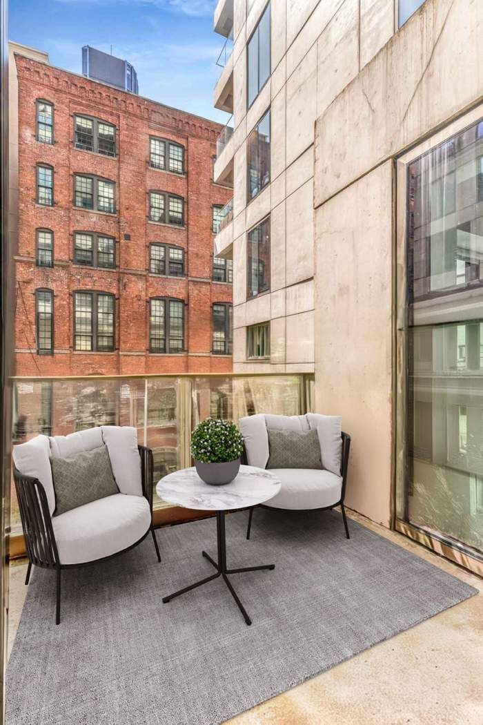 98 Front Street, Unit GRD Brooklyn, NY 11201 - Photo 9 of 23 a view of a patio with couches and a potted plant on a table