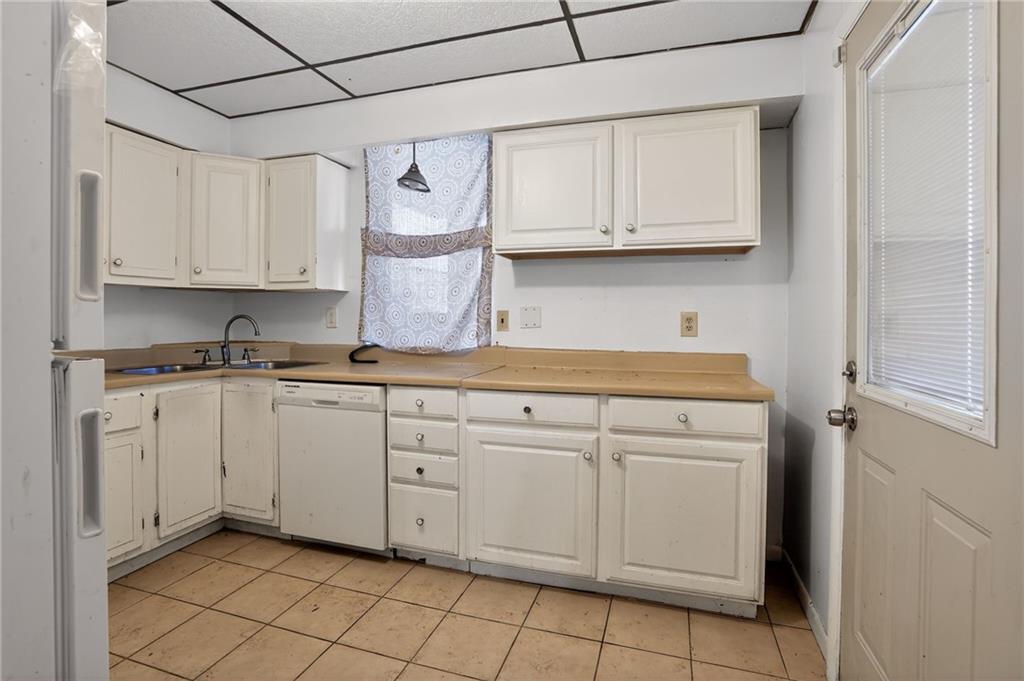 1212 Woodward Avenue McKees Rocks, PA 15136 - Photo 15 of 34 a kitchen with white cabinets and white appliances