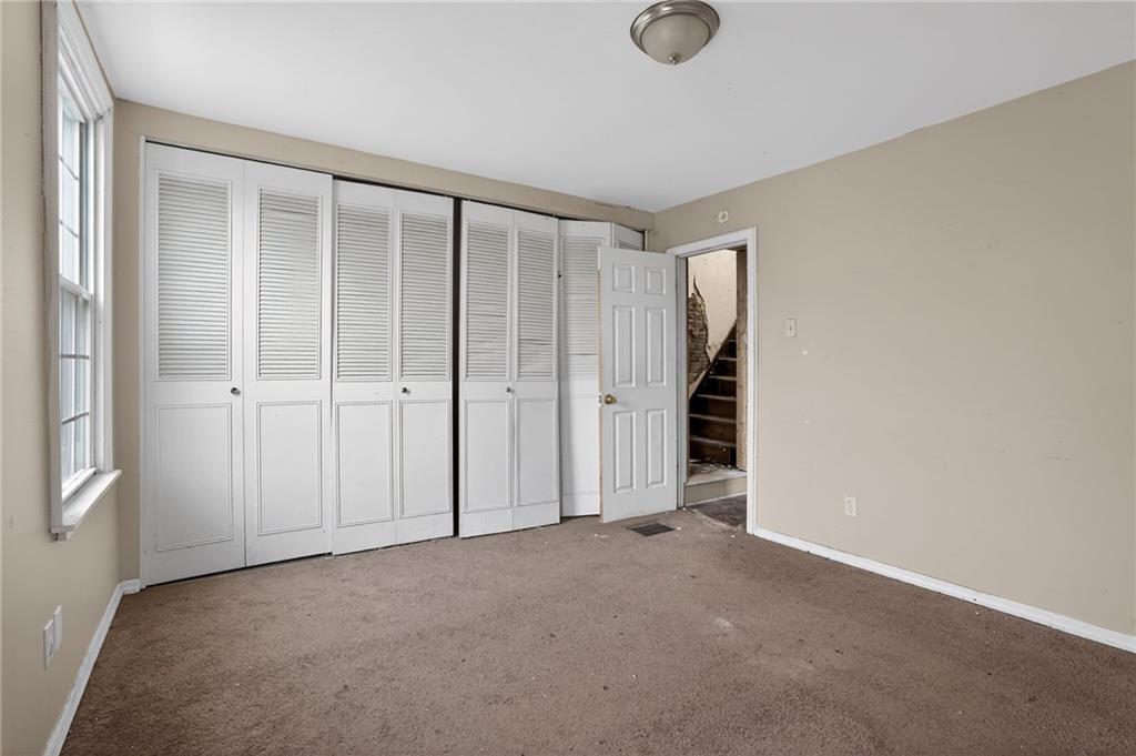 1212 Woodward Avenue McKees Rocks, PA 15136 - Photo 17 of 34 an empty room with a empty space and windows
