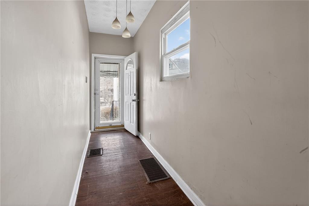 1212 Woodward Avenue McKees Rocks, PA 15136 - Photo 3 of 34 a view of a hallway with wooden floor