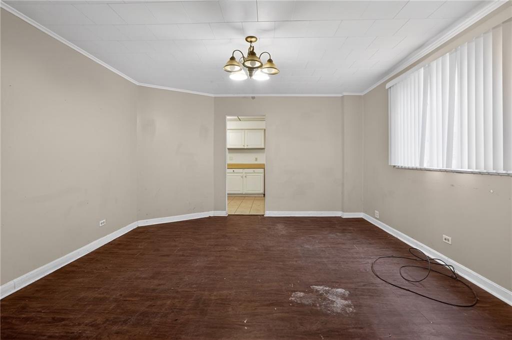1212 Woodward Avenue McKees Rocks, PA 15136 - Photo 5 of 34 wooden floor in an empty room with a window