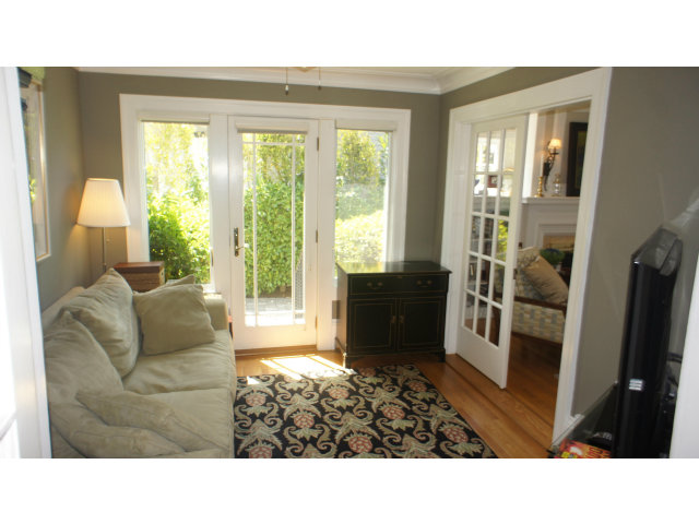 764 Edgewood Road San Mateo, CA 94402 - Photo 3 of 8 a living room with furniture and a flat screen tv