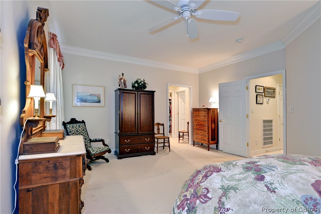 4220 Old Lock Road Williamsburg, VA 23188 - Photo 19 of 45 The first floor primary bedroom is spacious with two walk-in closets and en suite bath.