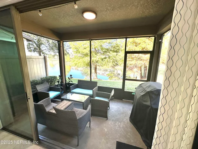 a spacious bedroom with a bed and wooden floor