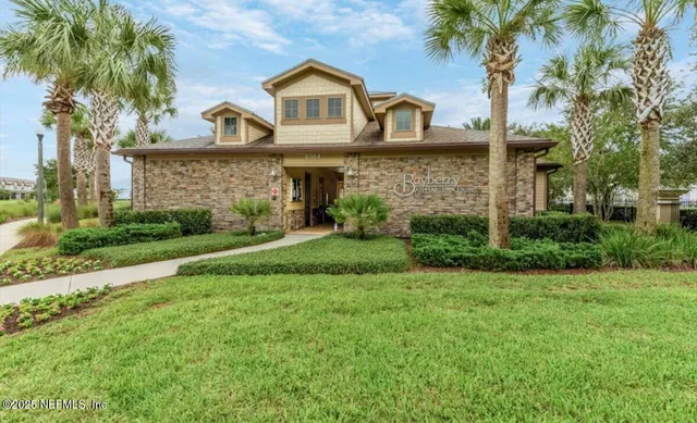 a room with gym equipment and a flat screen tv