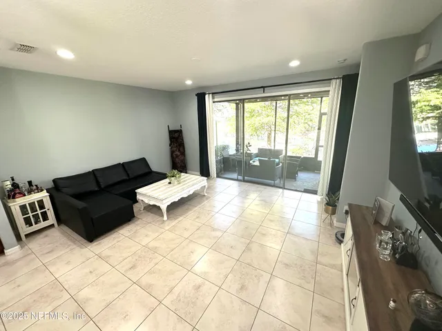a living room with furniture and a rug