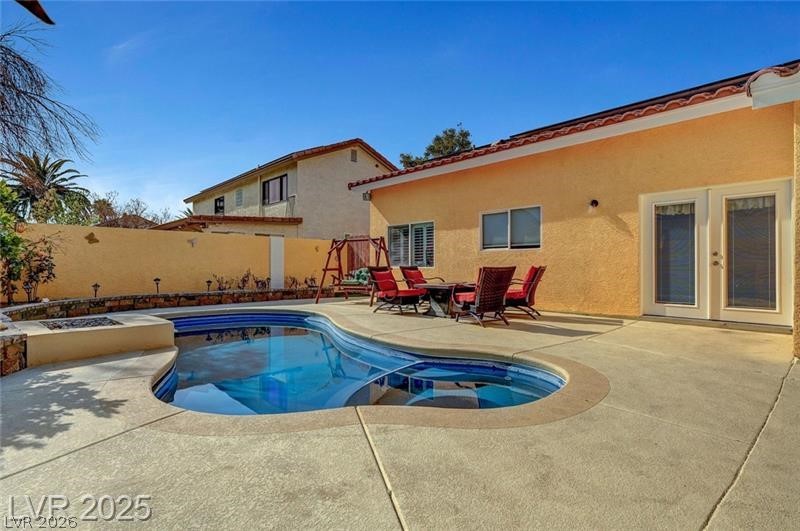 2410 Doherty Way Henderson, NV 89014 - Photo 56 of 63 View of pool with a fenced backyard, a patio, french doors, and a pool with connected hot tub