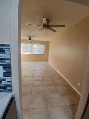 a view of an empty room and window