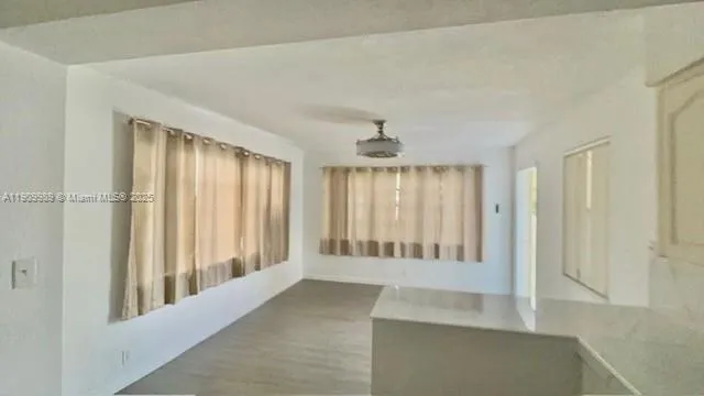a view of an empty room with a window