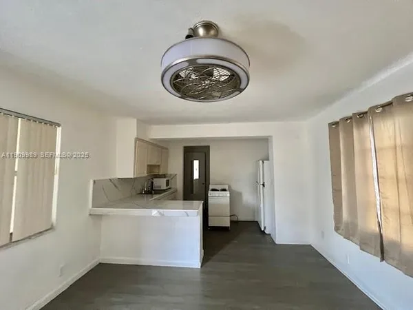 a view of a hallway with washer and dryer