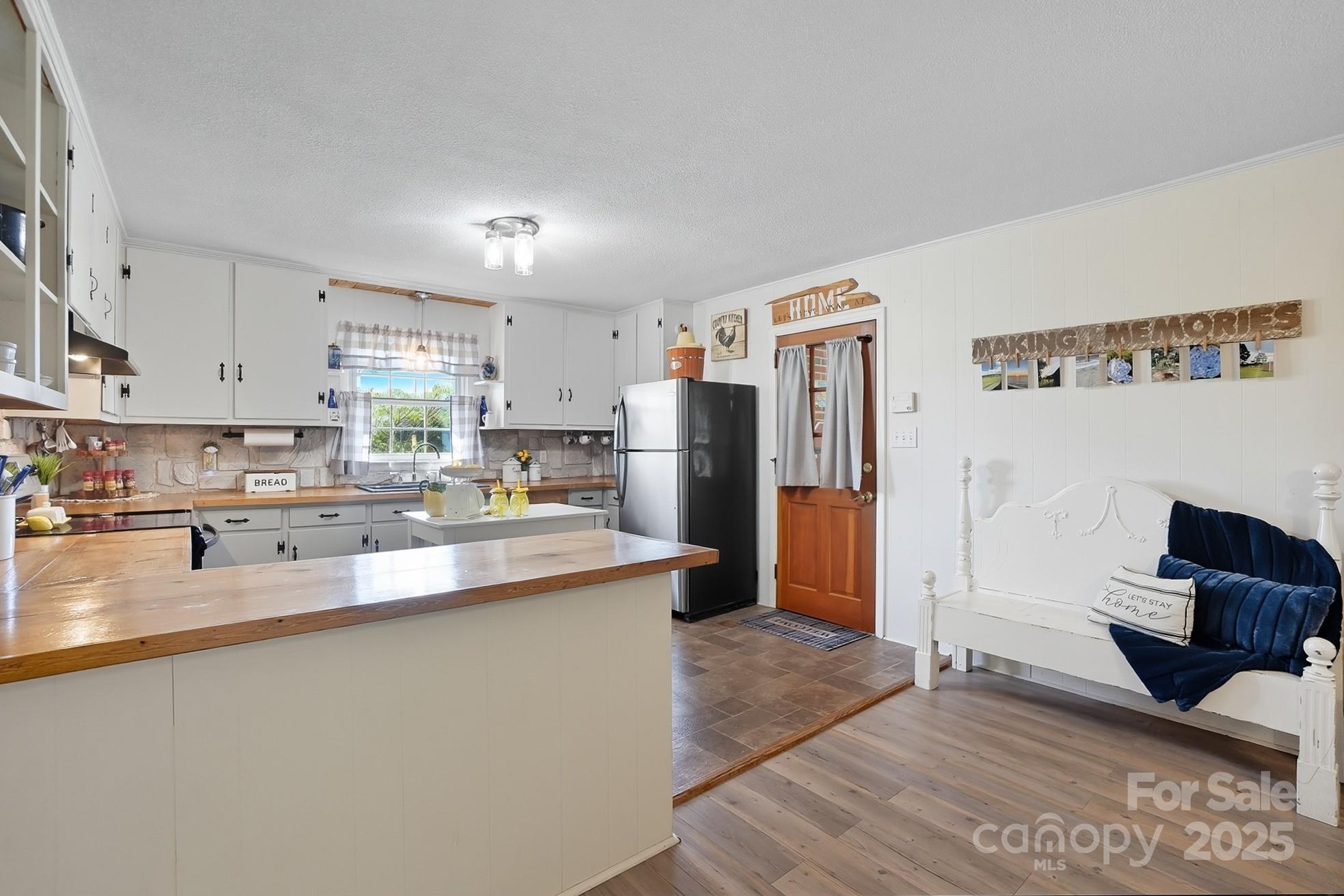 201 Airport Road Monroe, NC 28110 - Photo 14 of 47 a kitchen with stainless steel appliances granite countertop a refrigerator stove top oven and sink