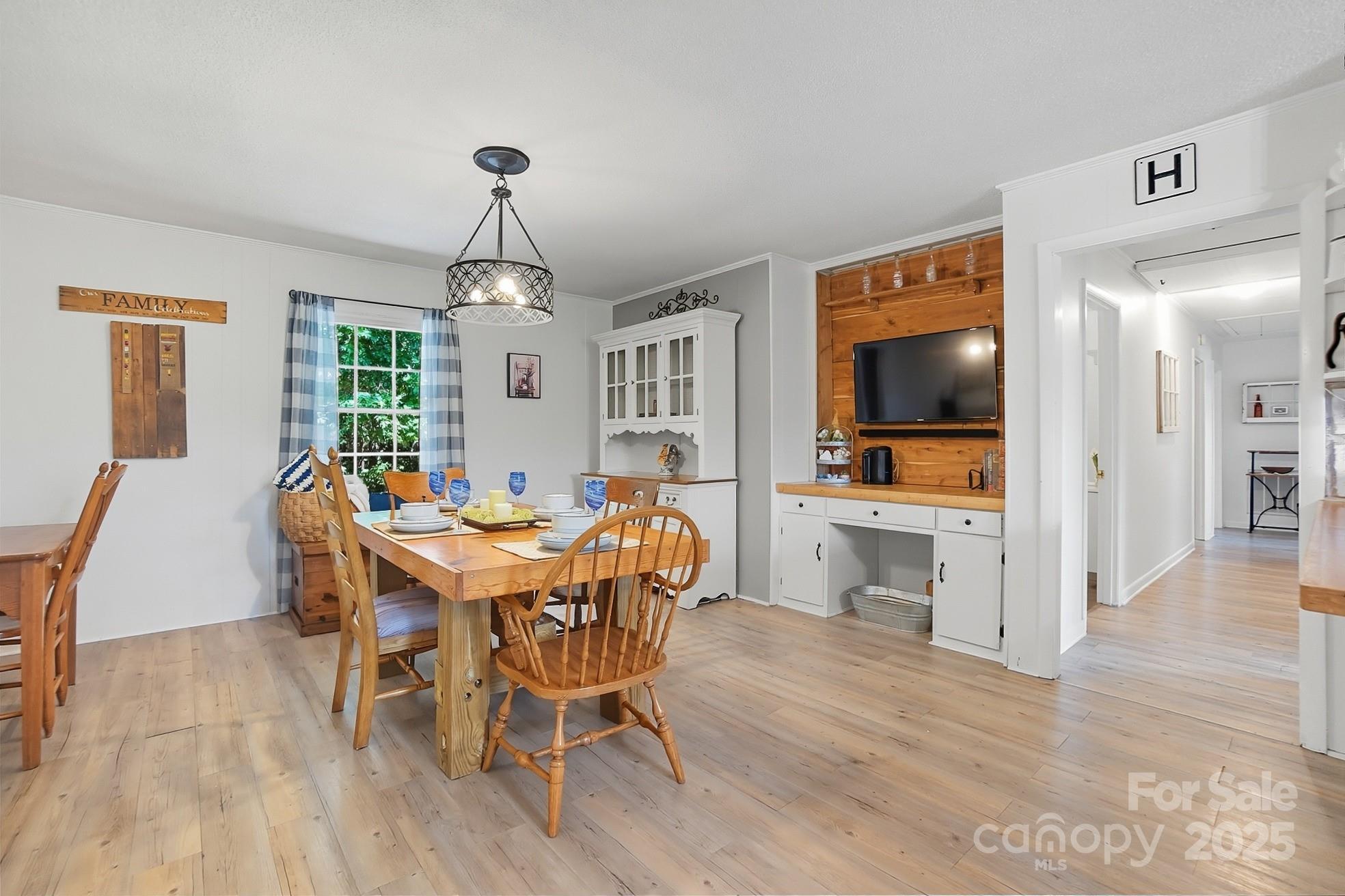 201 Airport Road Monroe, NC 28110 - Photo 15 of 47 a view of a dining room with furniture window and wooden floor