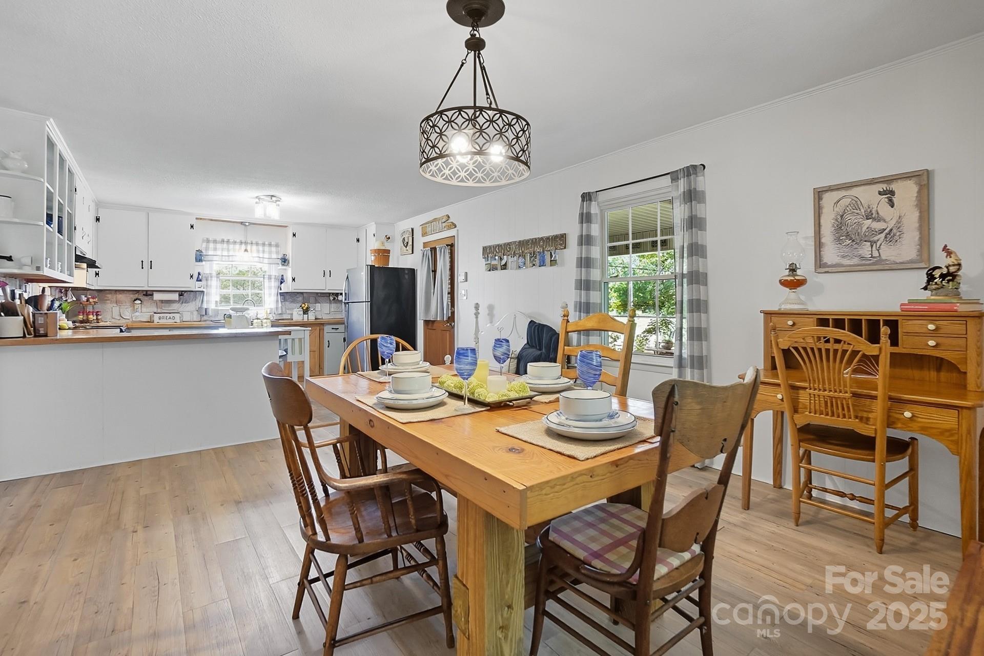 201 Airport Road Monroe, NC 28110 - Photo 18 of 47 a view of a dining room with furniture window and wooden floor