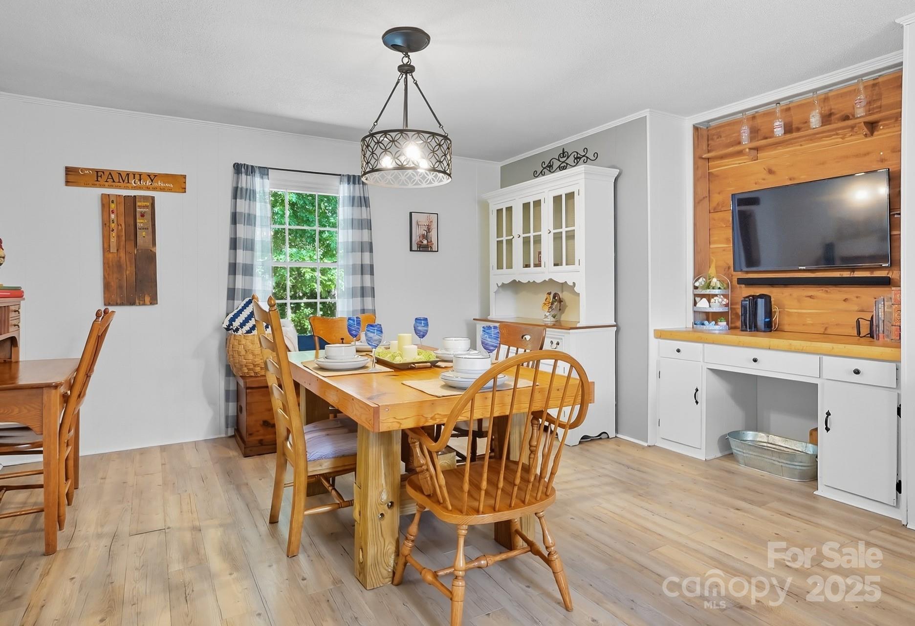 201 Airport Road Monroe, NC 28110 - Photo 19 of 47 a view of a dining room with furniture window and wooden floor