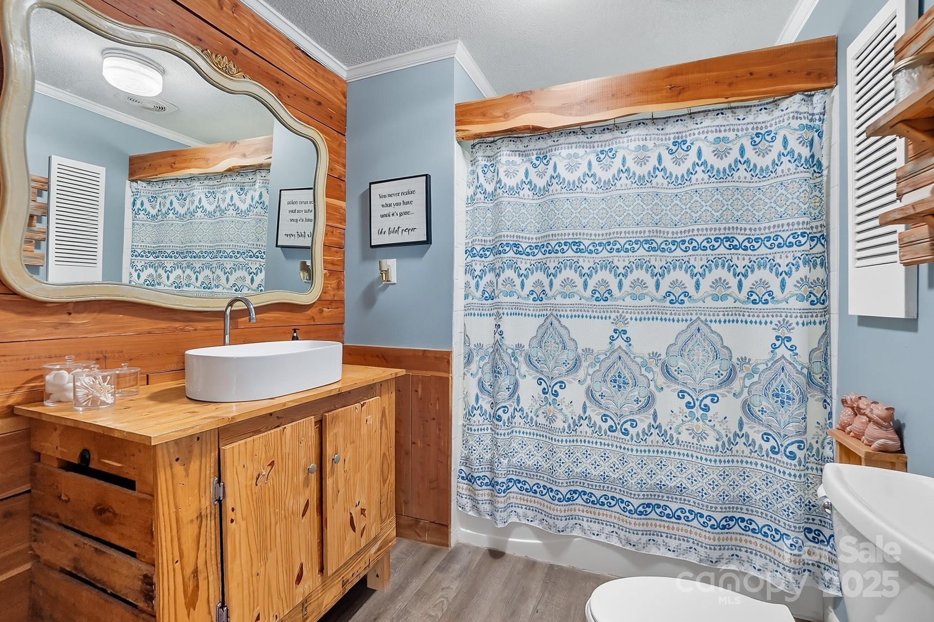 201 Airport Road Monroe, NC 28110 - Photo 26 of 47 a bathroom with a sink a mirror and a shower