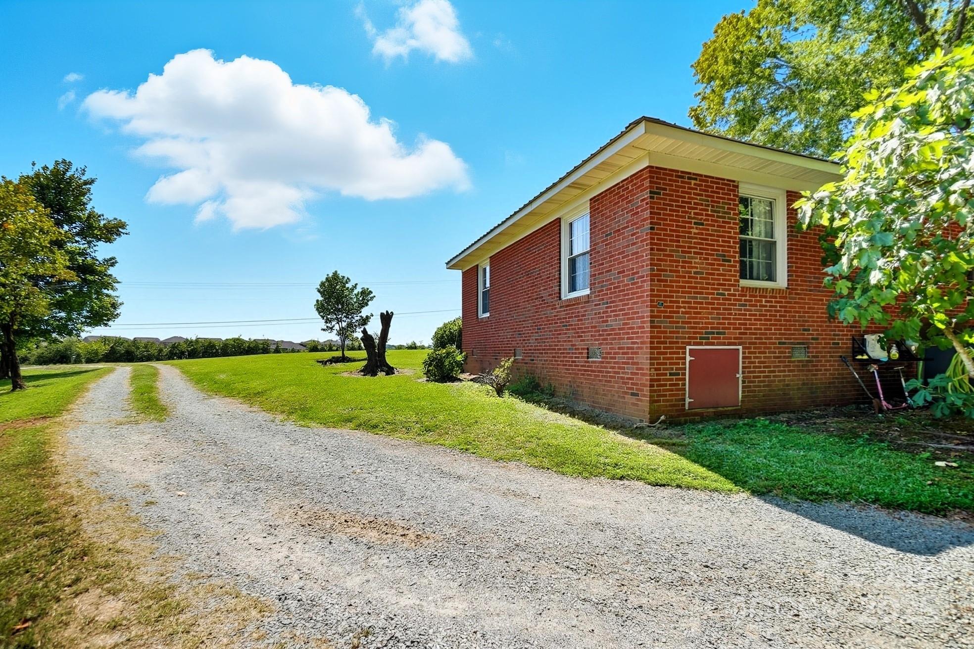201 Airport Road Monroe, NC 28110 - Photo 31 of 47 a front view of a house with a yard