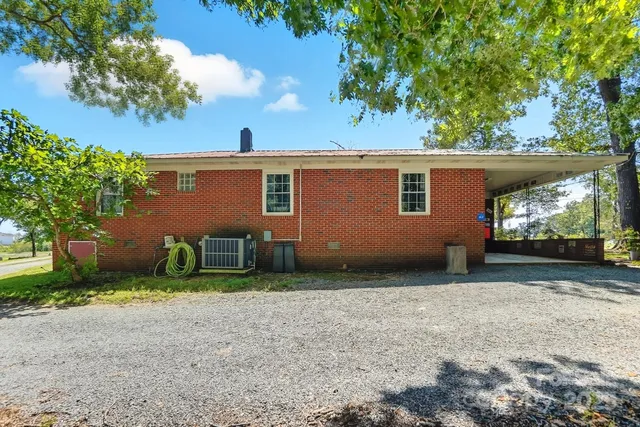 a view of a street with large trees