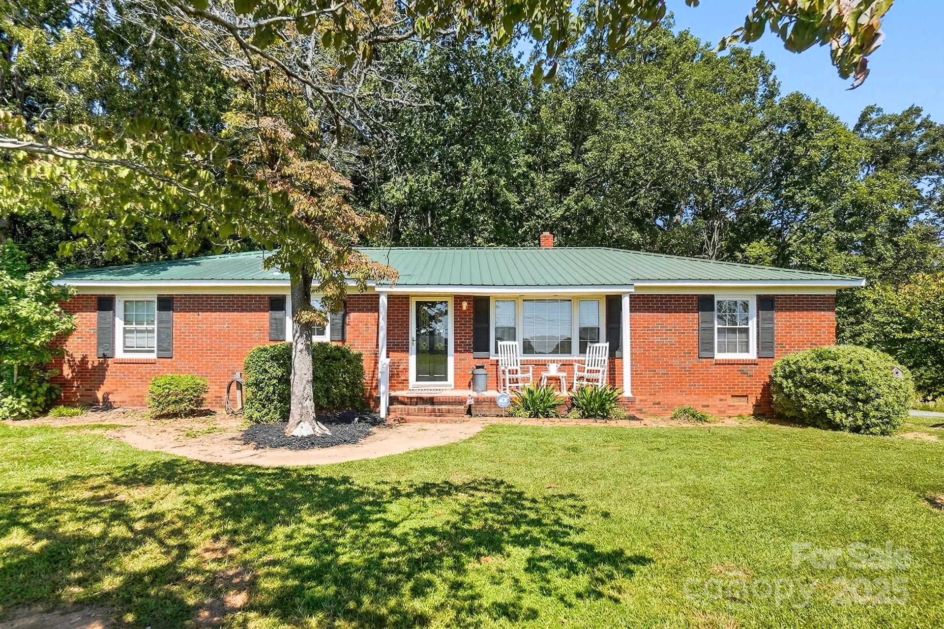 201 Airport Road Monroe, NC 28110 - Photo 4 of 47 a front view of house with yard and green space
