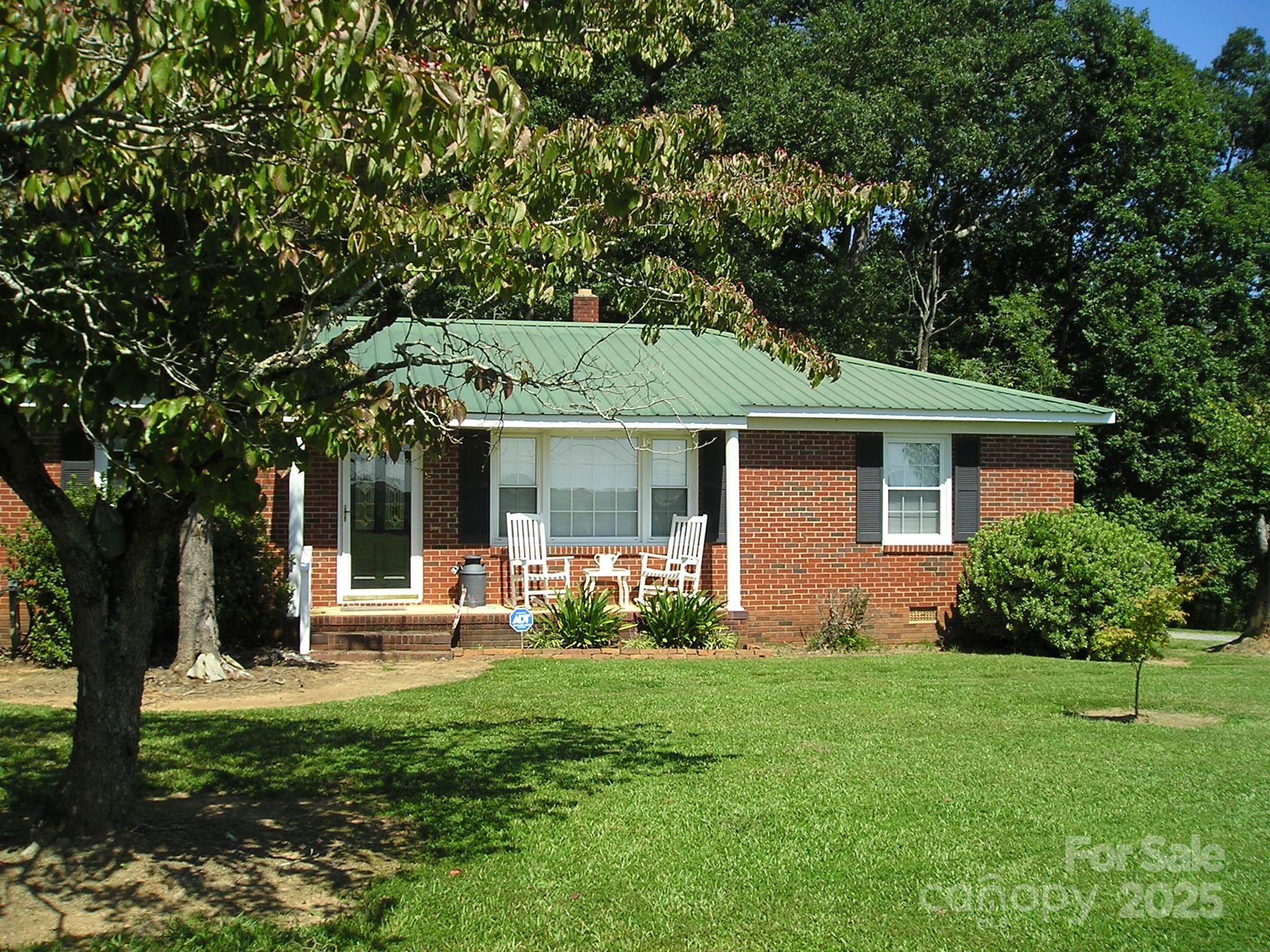 201 Airport Road Monroe, NC 28110 - Photo 44 of 47 a view of a house with a yard and sitting area
