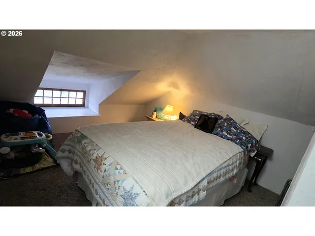 a black and white bed in a bedroom
