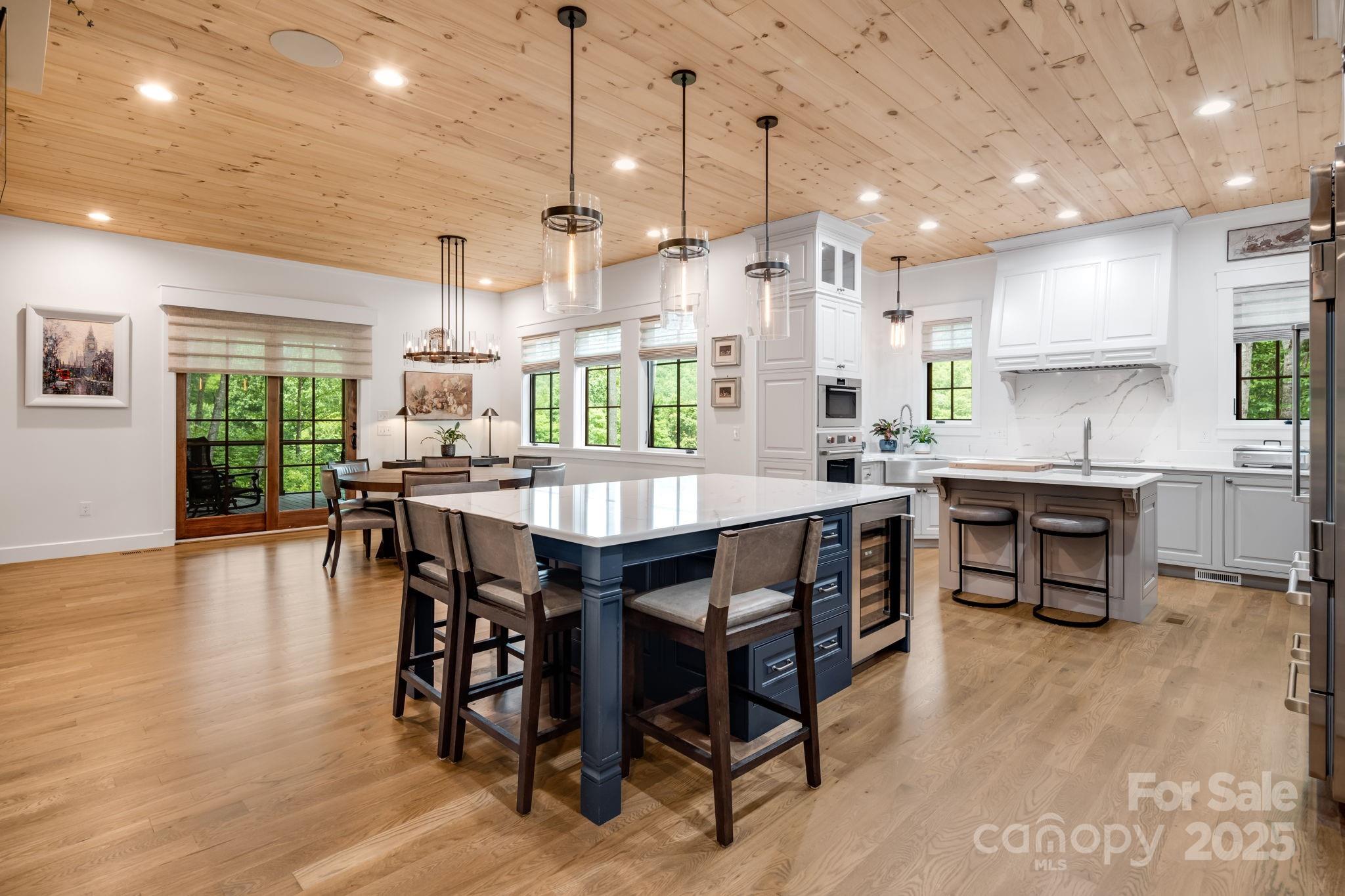 1416 East Clubhouse Road, Unit 73 Sylva, NC 28779 - Photo 12 of 48 a large kitchen with a table and chairs