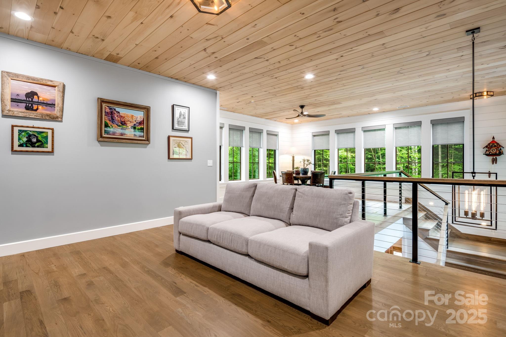 1416 East Clubhouse Road, Unit 73 Sylva, NC 28779 - Photo 23 of 48 a living room with furniture and a large window