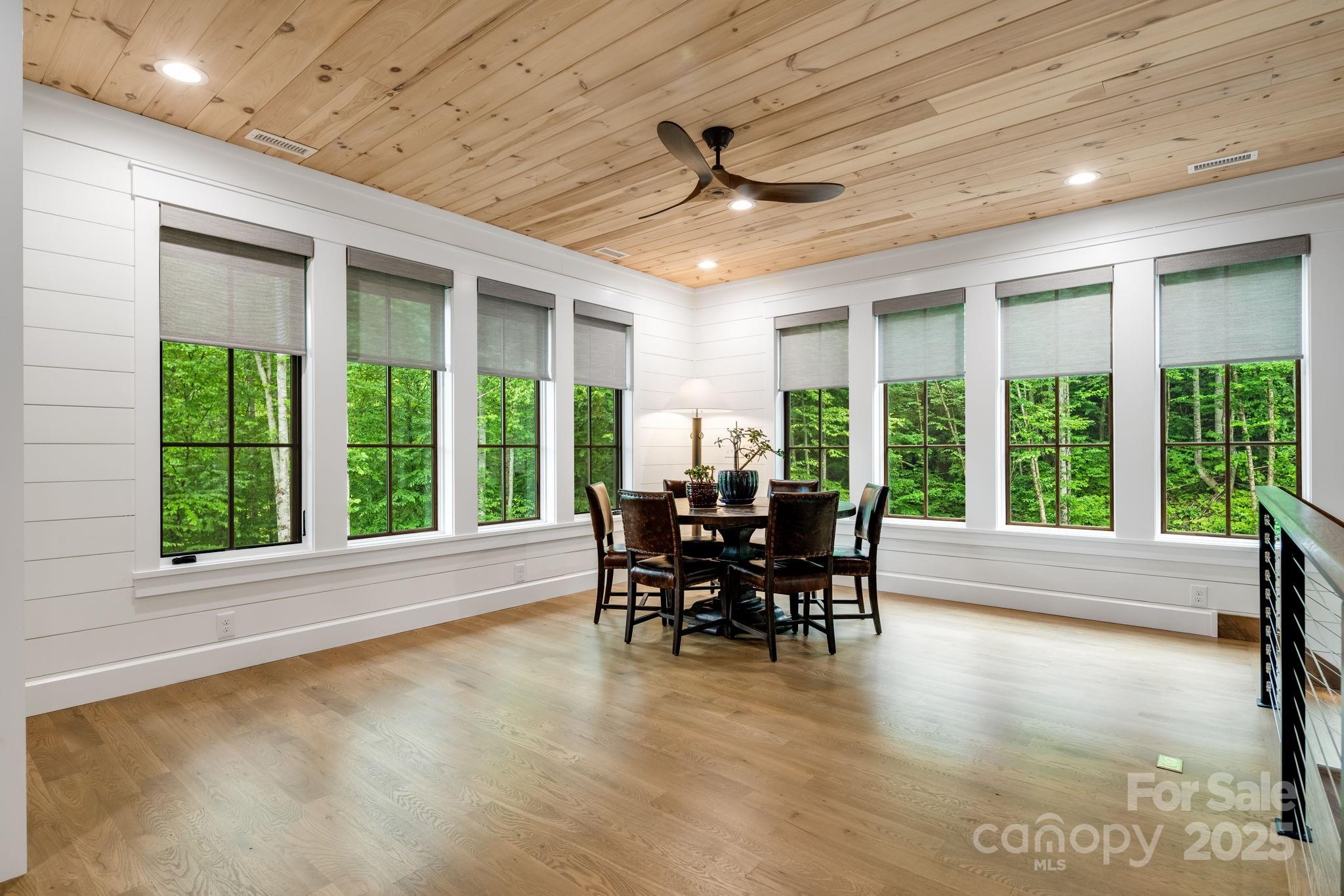1416 East Clubhouse Road, Unit 73 Sylva, NC 28779 - Photo 26 of 48 a dining room with furniture window and outside view