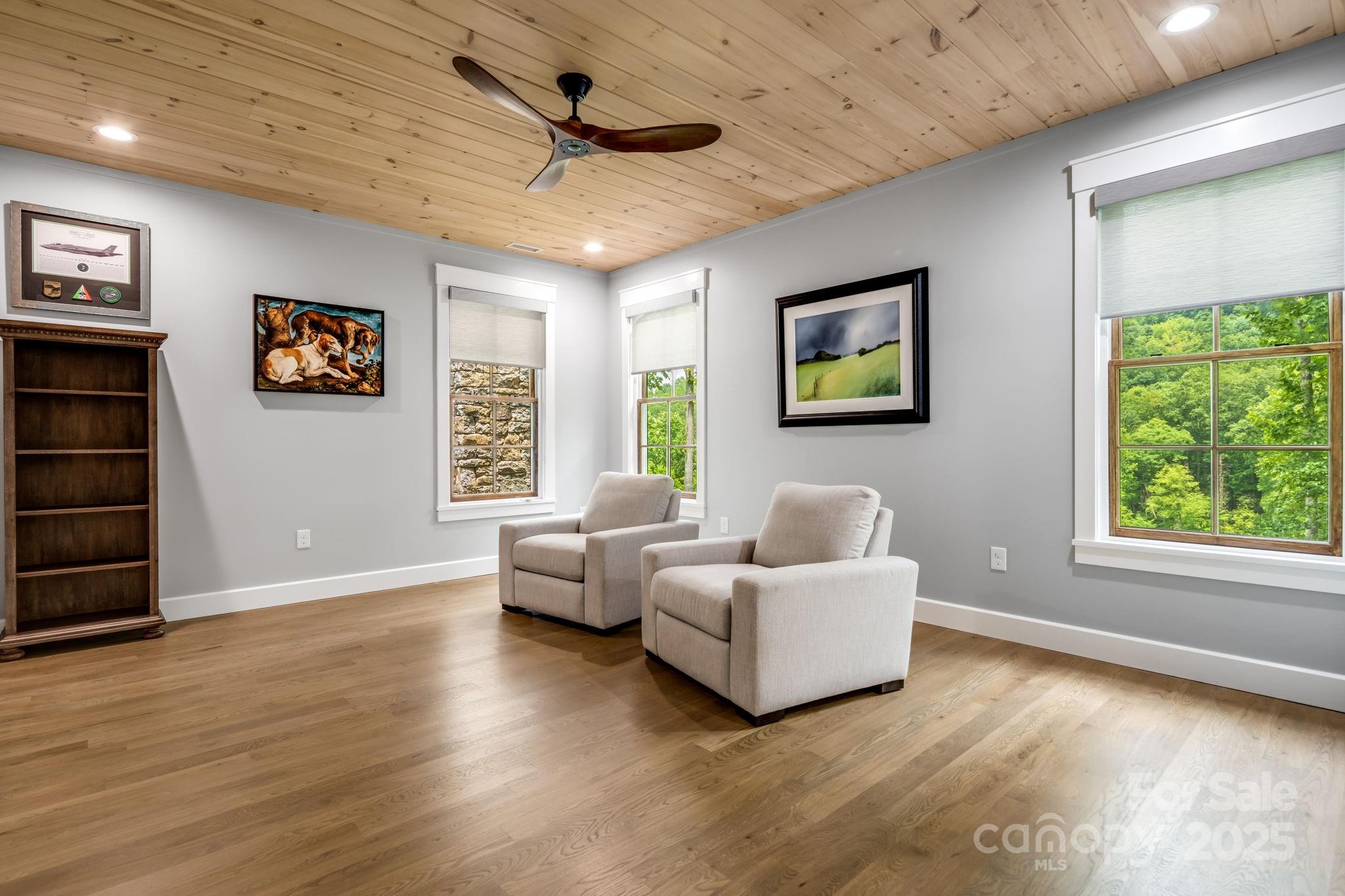 1416 East Clubhouse Road, Unit 73 Sylva, NC 28779 - Photo 27 of 48 a spacious bedroom with a bed and a large window
