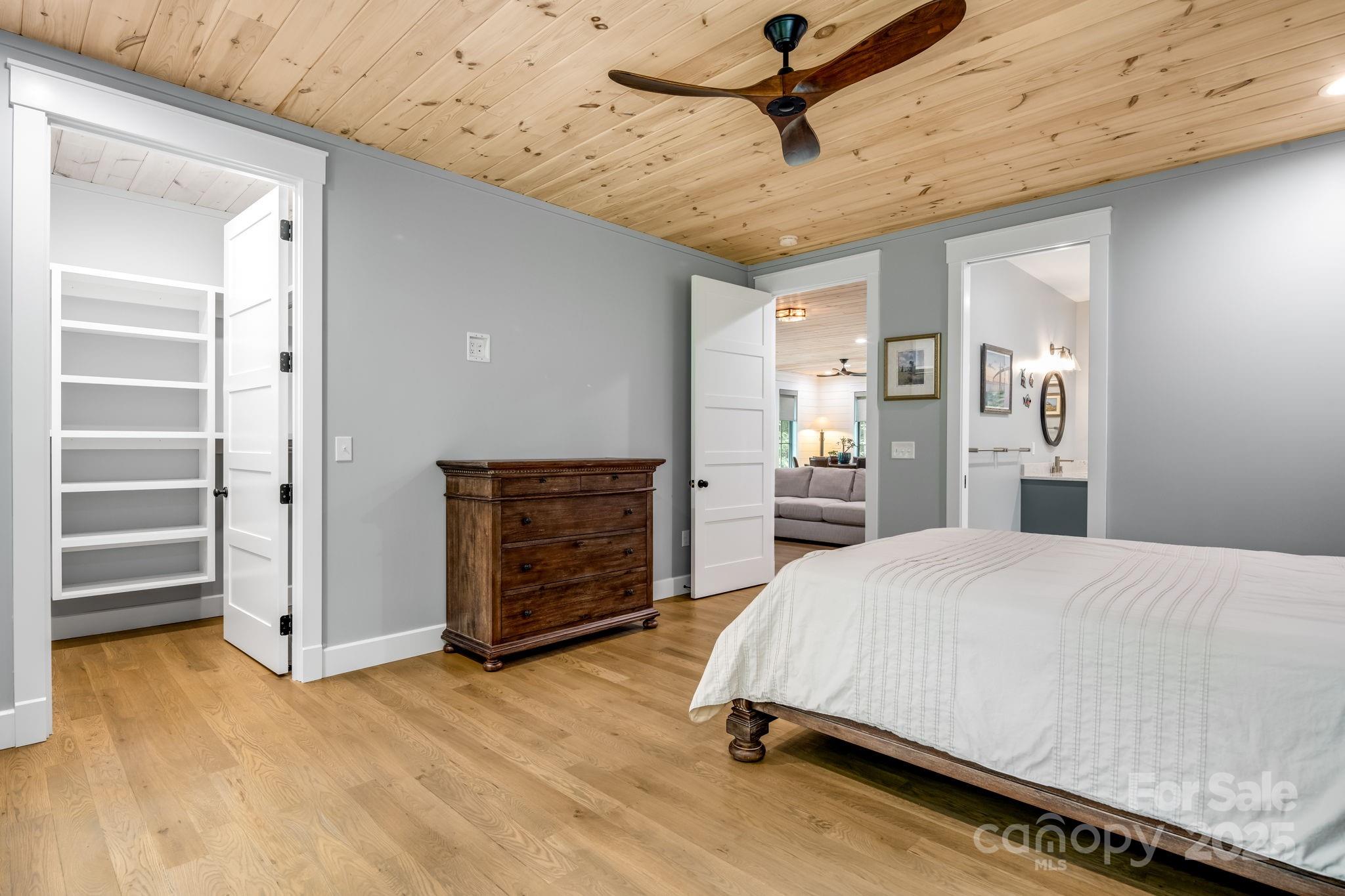 1416 East Clubhouse Road, Unit 73 Sylva, NC 28779 - Photo 29 of 48 a spacious bedroom with a bed and dresser