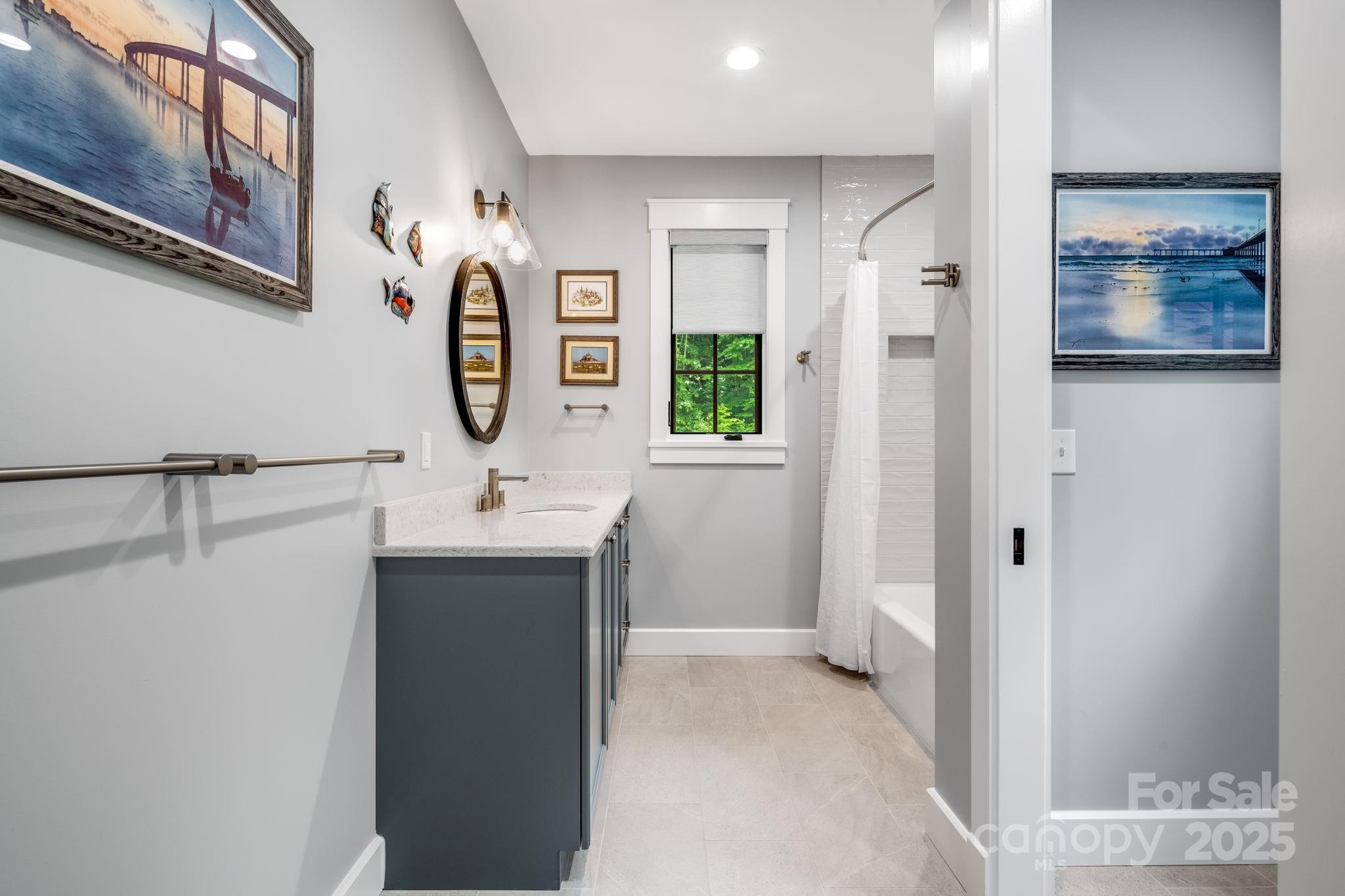 1416 East Clubhouse Road, Unit 73 Sylva, NC 28779 - Photo 31 of 48 a bathroom with a sink and a mirror