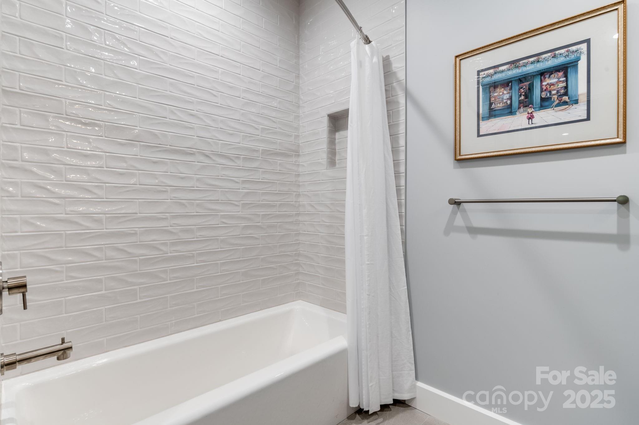 1416 East Clubhouse Road, Unit 73 Sylva, NC 28779 - Photo 33 of 48 a bathroom with a bathtub and a shower