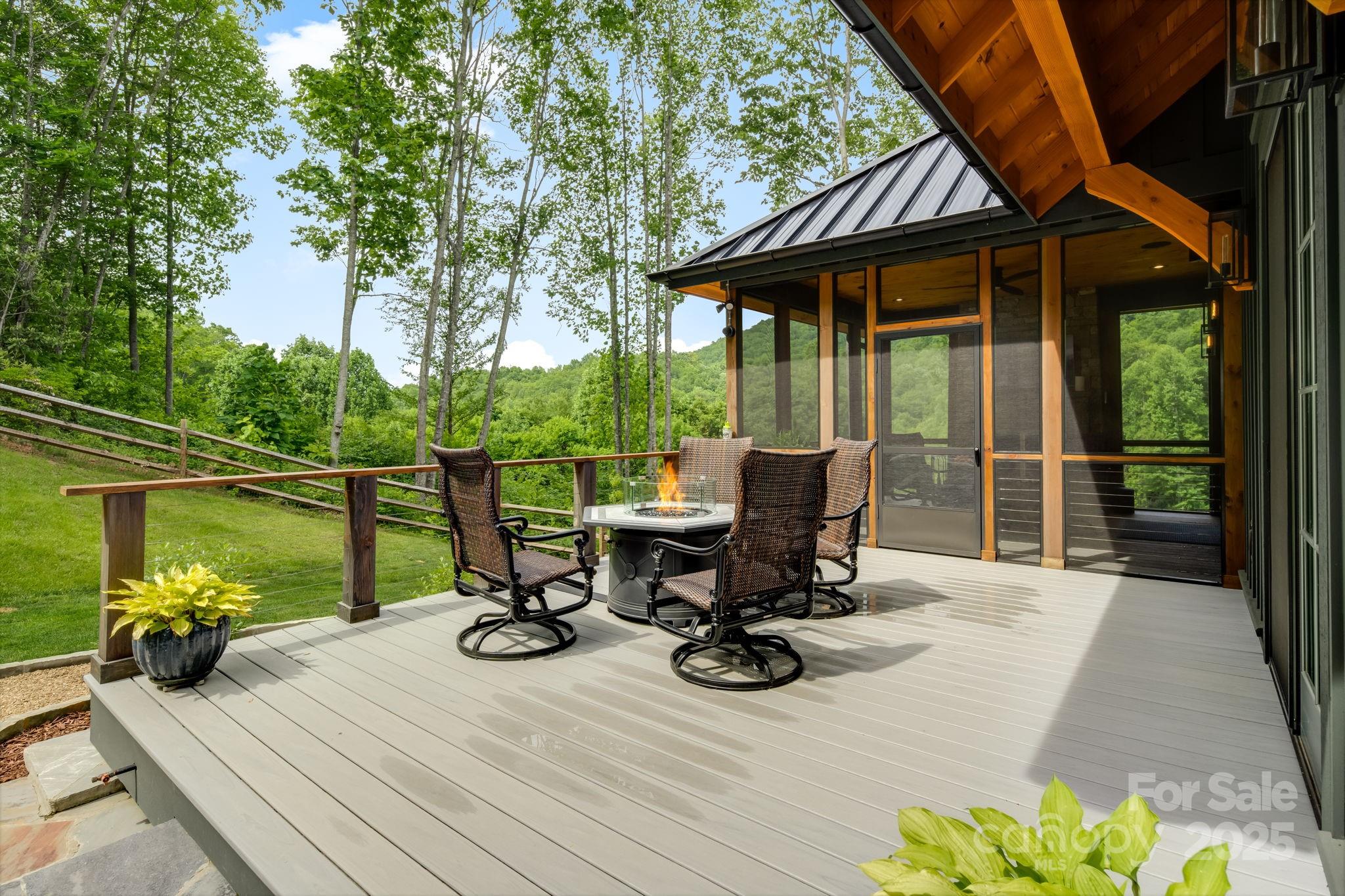 1416 East Clubhouse Road, Unit 73 Sylva, NC 28779 - Photo 34 of 48 a view of a deck with wooden floor and outdoor seating