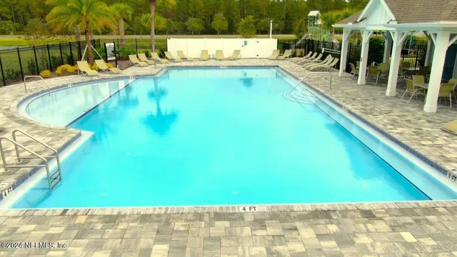 a view of a dinning table and chairs in the patio