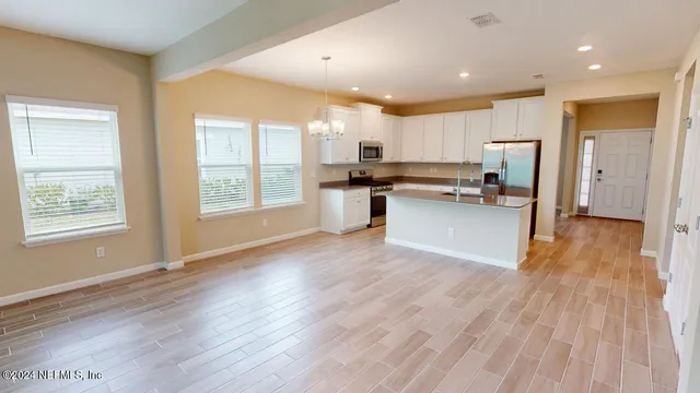 a kitchen with sink and window