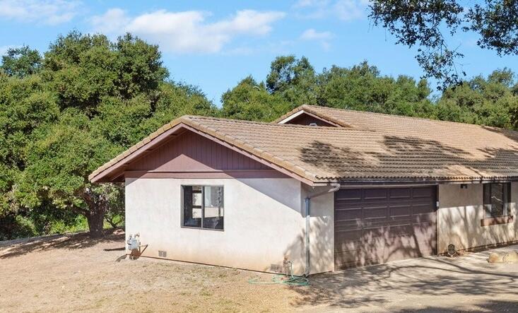 855 Rockbridge Road Santa Barbara, CA 93108 - Photo 1 of 1 a view of a house with a yard and large tree