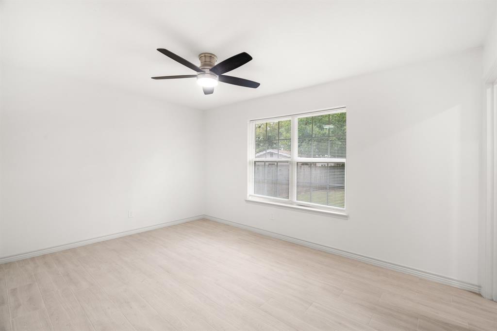 103 North Summit Street Red Oak, TX 75154 - Photo 14 of 26 an empty room with a window