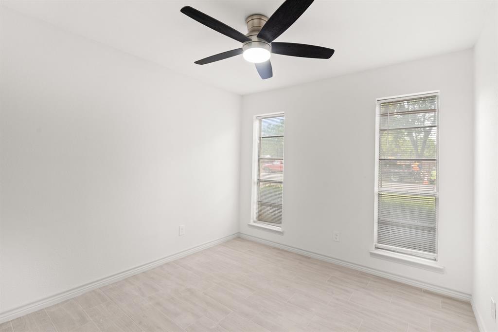 103 North Summit Street Red Oak, TX 75154 - Photo 20 of 26 an empty room with closet and windows