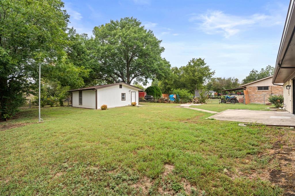 103 North Summit Street Red Oak, TX 75154 - Photo 23 of 26 a front view of a house with garden