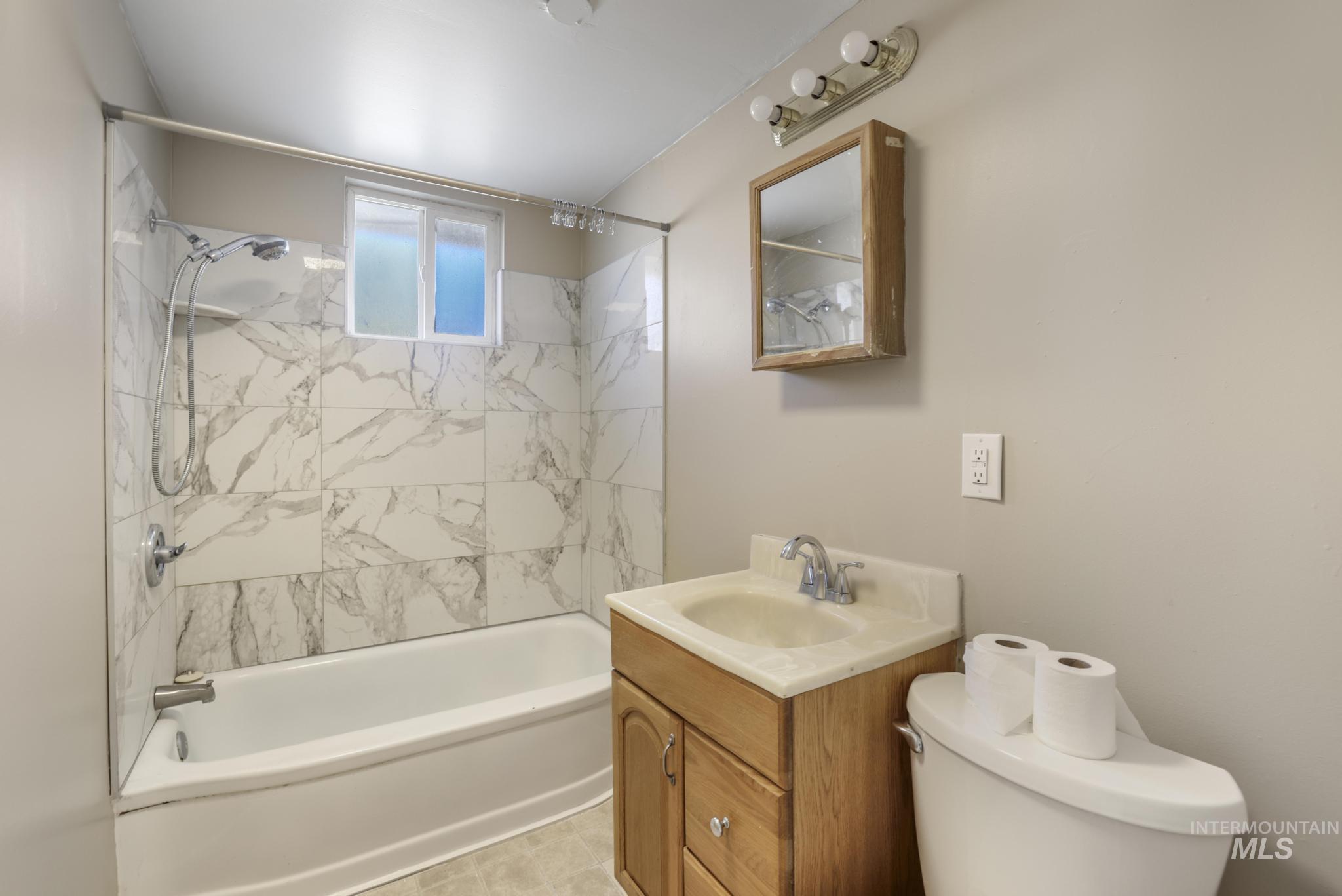 525 Adams Street Twin Falls, ID 83301 - Photo 20 of 31 Full bathroom featuring tub / shower combination and vanity