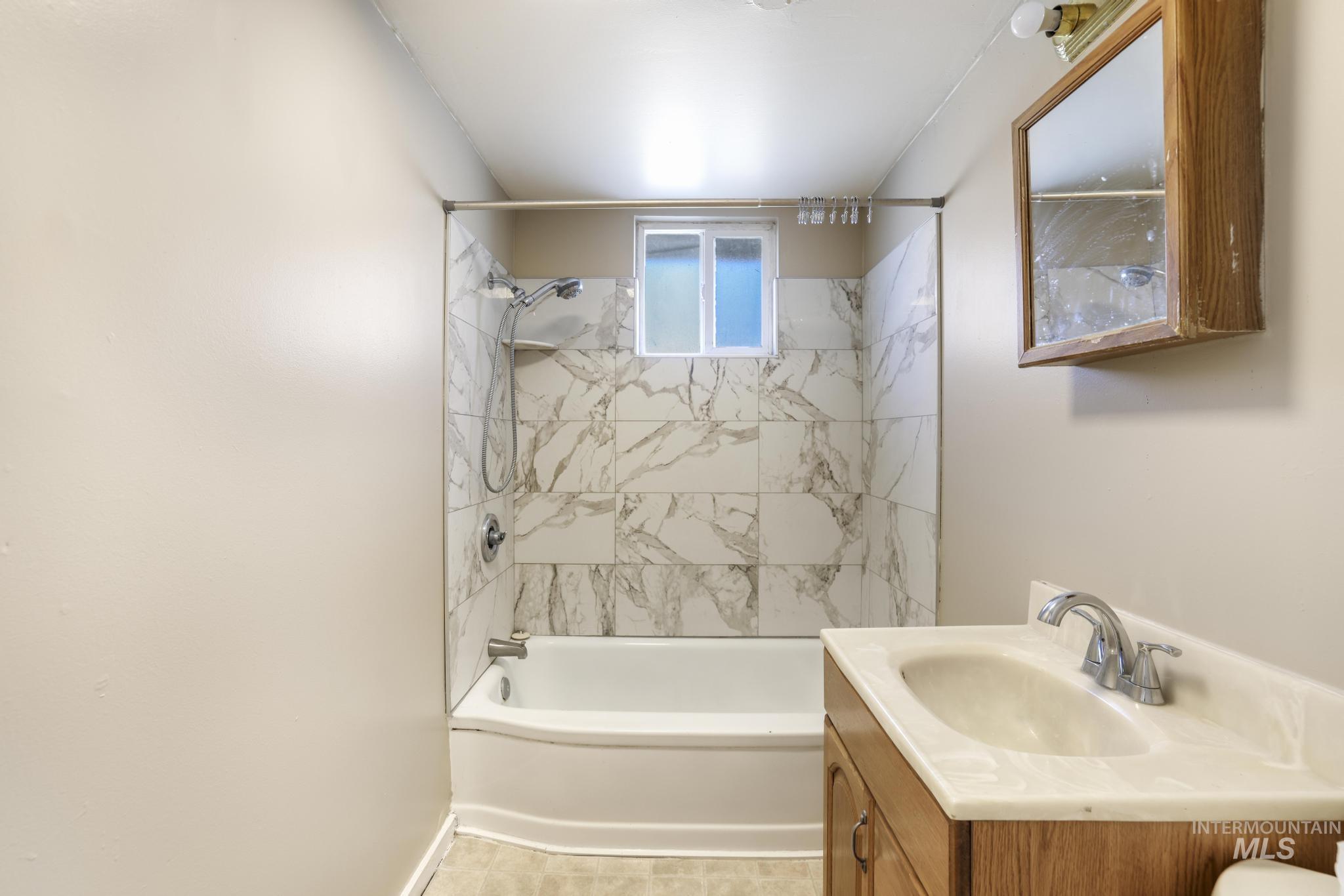 525 Adams Street Twin Falls, ID 83301 - Photo 21 of 31 Full bathroom with shower / bathtub combination and vanity