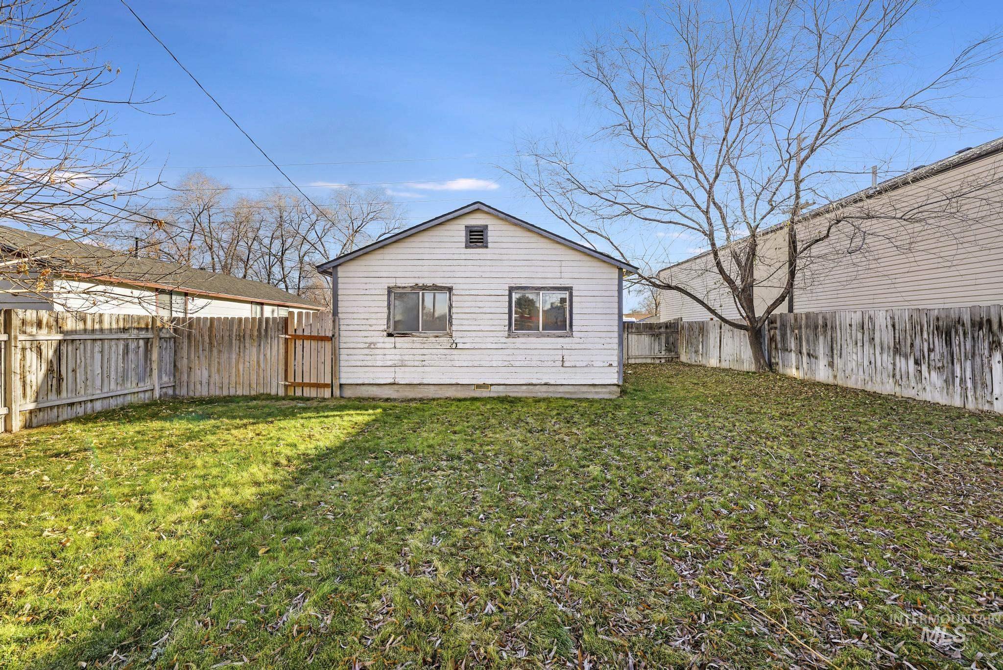525 Adams Street Twin Falls, ID 83301 - Photo 25 of 31 Back of property with a fenced backyard